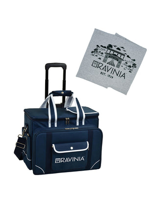 A blue Ravinia branded cooler with a wheeled cart and a gray and green sweatshirt blanket, on a white background.