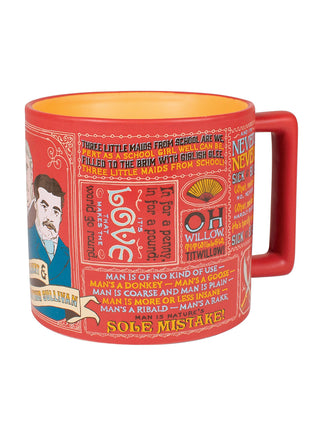 A red mug with a handle on the right, covered with quotes from musical duo Gilbert and Sullivan.