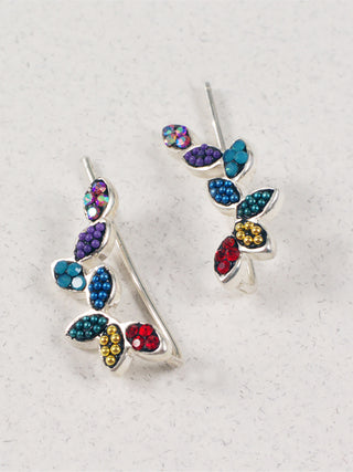 Silver climber earrings with bedazzled leaves in rainbow colors.