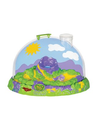 A closeup of the domed ladybug habitat, featuring a sunny background, a watering reservoir, and a built-in magnifying lid.