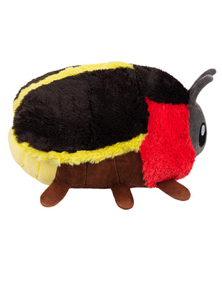 A large black, red and yellow plush firefly, seen from the side.