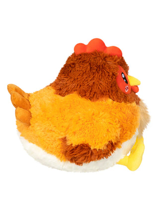 A plush hen stuffed animal from a side view.
