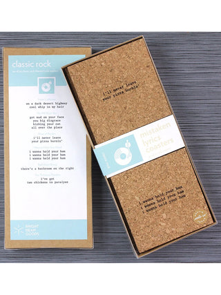 A set of square cork coasters with laser engraved wrong lyrics; the back of the box says "Classic Rock" and gives a list of songs and the mistaken lyrics.