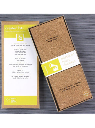A set of square cork coasters with laser engraved wrong lyrics; the back of the box says "Greatest Hits" and gives a list of songs and the mistaken lyrics.