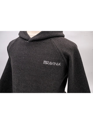 A closeup view of the Ravinia logo in white on the left.