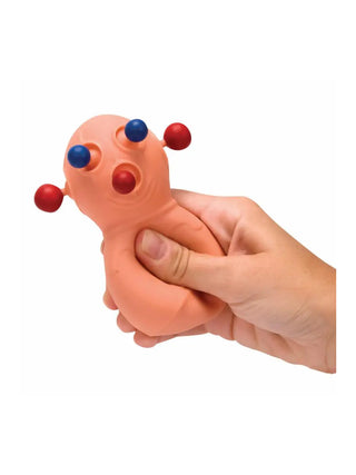 A hand squeezing a stress toy with blue eyes, red ears, and a red nose, all popping out.