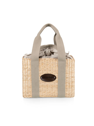 A woven seagrass picnic basket with sea green handles, a sea green and white striped fabric interior, and a leather embossed plate that says Ravinia.