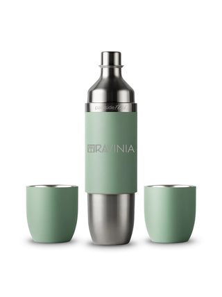 A green and stainless steel wine flask with the Ravinia logo, with two tumblers at its side.