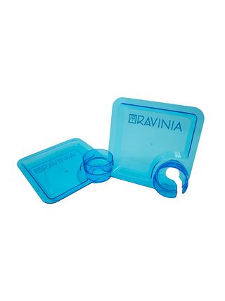 Two blue square acrylic plates with a drink holder.