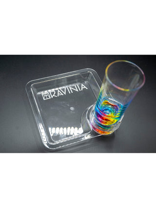 A clear square acrylic plate with a rainbow tumbler held in the drink holder, on a black background.