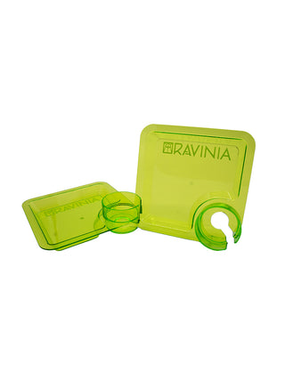 Two green square acrylic plates with a drink holder.