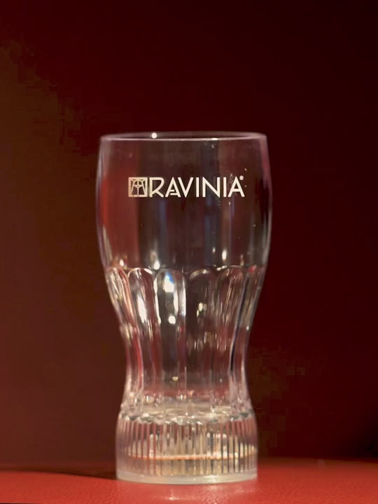 A Ravinia branded clear glass that lights up with different colors in the video.