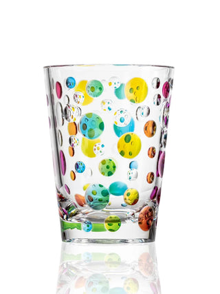A clear acrylic tumbler with colorful dots.