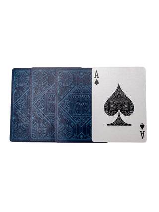 Three playing cards facedown with a Ravinia exclusive design, and the Ace of Spades with a Ravinia exclusive design of the Tyler Gate.