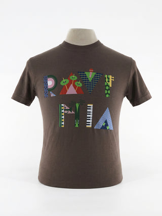 A brown t-shirt with a bright and colorful Ravinia design on a mannequin.