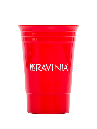 A red plastic cup with the Ravinia logo.