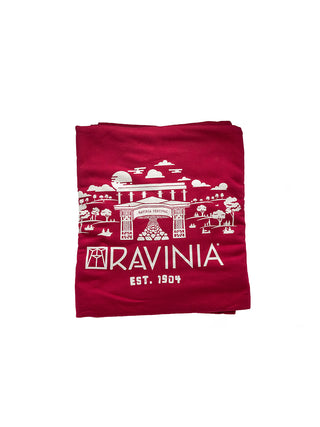 A red blanket, folded, with a white Ravinia branded design.