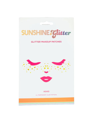 Gold glitter face makeup patches with hearts.