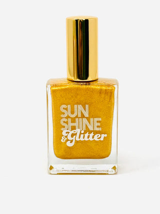 A clear bottle with gold shimmer oil, with a gold cap and the words Sunshine & Glitter.