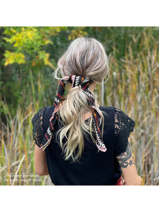 A model in a black shirt with a Sari Chic Bandana tying their hair back.