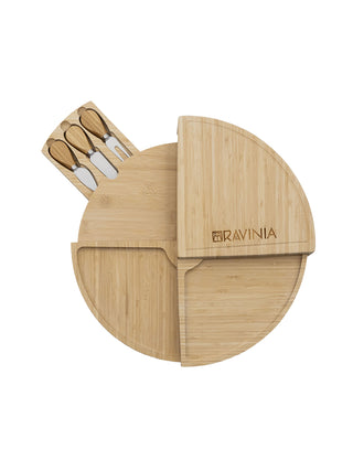 A bamboo cheese board with the Ravinia logo in the shape of a circle, with a pull-out drawer with three cheese tools.