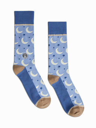 Two blue socks with white crescent moons.