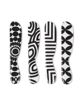 Four spreaders flat, in a row, each with a unique black-and-white pattern.