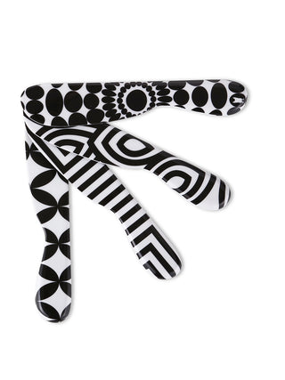 Four spreaders with their tips touching, fanned out,, each with a unique black-and-white pattern.