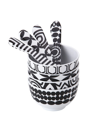 Four black-and-white spreaders in a black-and-white bowl.