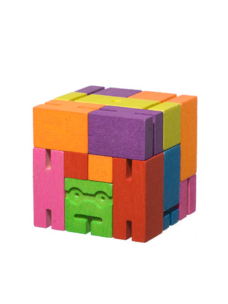 A blocks make op of multicolored squares, with a green face in the lower center.