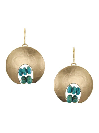 A pair of earrings with large brass crescents on top and two rows of small turquoise beads underneath.