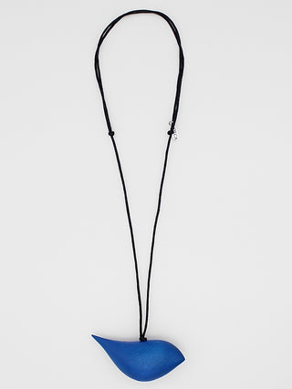 A cobalt blue wooden bird pendant hangs on an adjustable black wax cord.