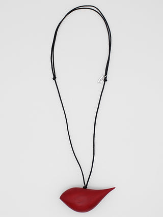 A red wooden bird pendant hangs on an adjustable black wax cord.