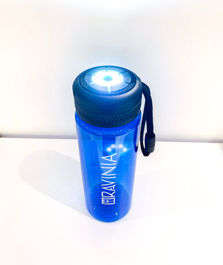 Blue water bottle with Ravinia logo on side, flashlight on top lit.