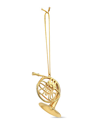 An ornament that looks exactly like a gold French horn, complete with a cord for hanging.