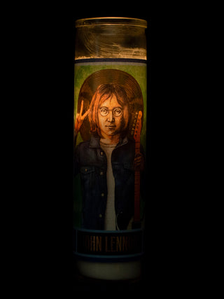 A lit votive with an illustration of John Lennon giving the peace sign on it.