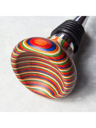 The vibrantly colored handle of a piece of barware.
