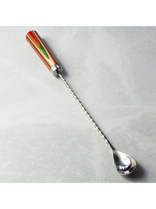 A bar spoon with a very long, twisting stem and a vibrantly-colored handle.