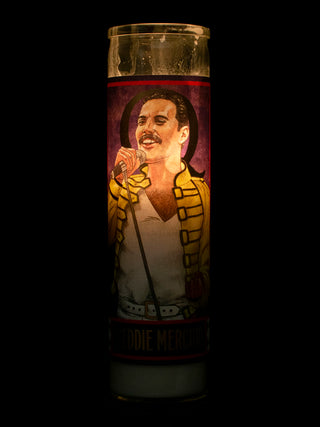 A lit votive with an illustration of Freddie Mercury on it.