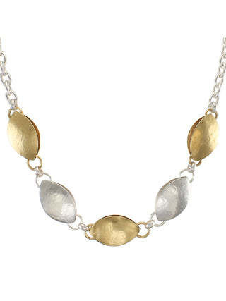 Alternating brass and silver pods on a silver chain necklace.