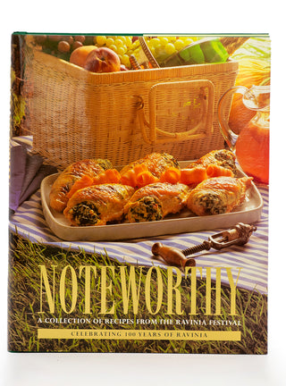 Ravinia’s Noteworthy cookbook features delectable looking appetizers, a corkscrew and picnic basket on its cover.