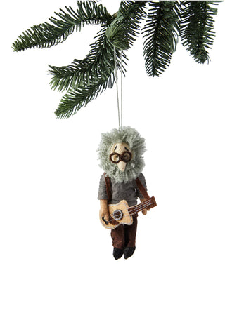 A holiday ornament depicting Jerry Garcia, hanging from a holiday tree branch.