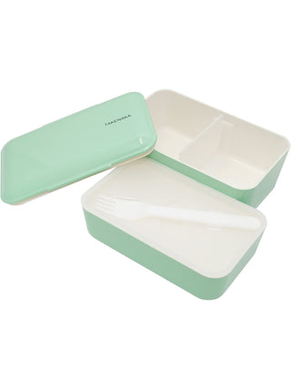 A mint-green rectangular box, open, with the lid on the left and the two white interior sections on the right. The section at the top has a spacer in the middle, and the one at the bottom has a white plastic fork in it.
