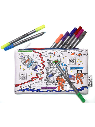 A space themed pencil case with astronauts visible, partially colored in, with colored markers spread out around it.