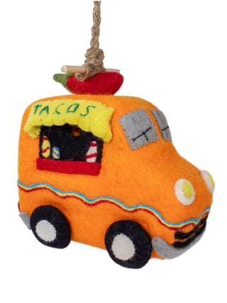 An orange felt birdhouse that looks like a taco truck, hanging from a rope.