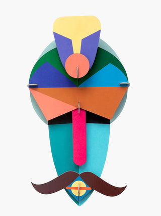 A colorful carboard mask depicting a man with a turban and mustache.