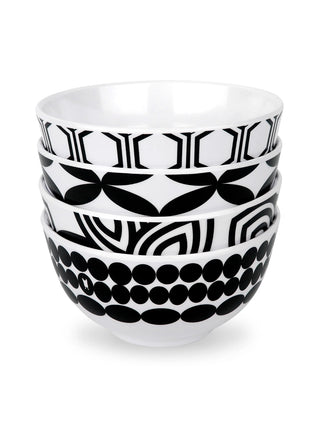 A stack of four bowls, each with a different black and white pattern.