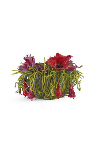A silicone vase featuring red poppies and green grasses that make it look natural.