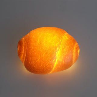 The Petite Roll Real Bread Lamp looks like the real thing, thanks to the warm, amber glow from its LED.