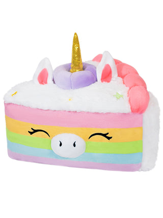 A plush, striped piece of cake that's also a unicorn, a happy face on its side..